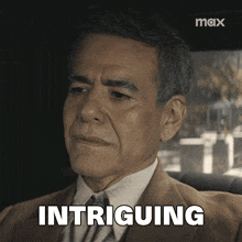 a man in a suit and tie is sitting in a car with the word intriguing above him