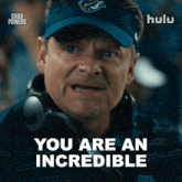 a man wearing a blue hat and headphones says you are an incredible