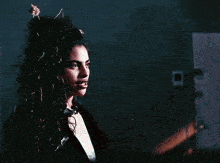 a man and a woman are looking at each other and smiling .