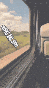 a picture of a train window with the words take the train on it