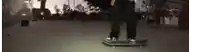 a person is doing a trick on a skateboard on a street .