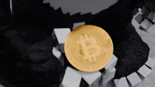 a gold coin with the letter b on it is surrounded by white cubes