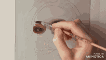 a person is painting a picture of a woman 's face with a brush