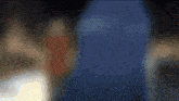 a blurry picture of a person in a red dress