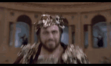 a group of men in costumes are standing in a room