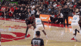 a basketball game is being played on a court with a sign that says tangerine