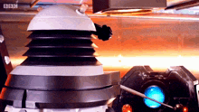 a bbc logo can be seen on the bottom right of a robot