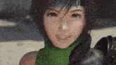 a woman with a green scarf around her neck smiles