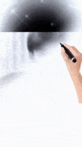 a hand is holding a pen and drawing a picture of a man 's face