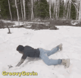 a man laying on his stomach in the snow with groovy gavin written on the bottom