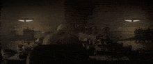 a person is laying on a bed in a dark room with a window in the background .