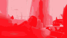 a woman laying on a couch in a living room with a red background