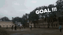 a group of people are playing basketball on a court with the words goal written on the bottom