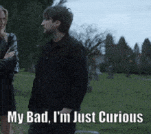 a man and a woman are standing in a cemetery with the words my bad i 'm just curious