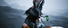 a woman is riding a motorcycle with a green light attached to the back
