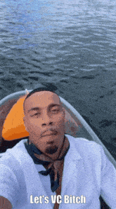 a man taking a selfie in a boat with the words let 's vc bitch above him