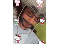 a girl wearing a hello kitty hat and glasses