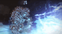 a close up of a glowing object in the dark with a lightning bolt coming out of it .