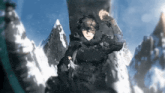 a man in a black suit is standing in front of a snowy mountain .
