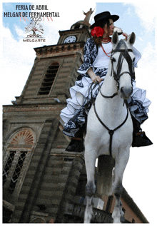 a woman is riding a white horse in front of a clock tower with the words feria de abril melgar de fernamental