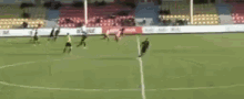 a group of soccer players are playing a game on a field