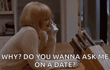 a woman is sitting at a table talking on a phone and asking why do you wanna ask me on a date .