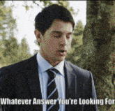 a man in a suit and tie with whatever answer you 're looking for written on the bottom