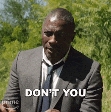 a man in a suit and tie says do n't you .