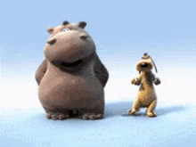 a hippo and a dog are standing next to each other