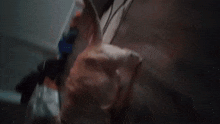 a blurred image of a person walking in a dark room