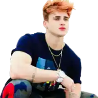 a young man with red hair has a tattoo on his arm that says i love you