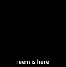 a picture of a stuffed animal with the words reem is here on the bottom
