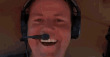 a man wearing bose headphones and a microphone