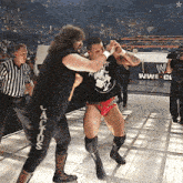 a wrestler with the word cactus on the side of his pants