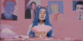 a girl with blue hair is playing a card game