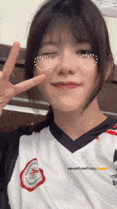 a girl wearing a white shirt that says tigers on it