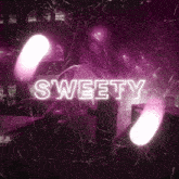 a neon sign that says sweety is lit up in pink