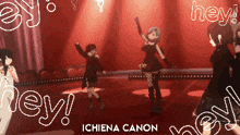 a group of girls are dancing on a stage with the words hey ichiena canon in the corner