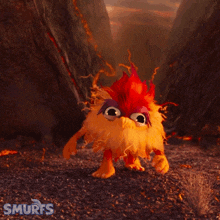 a cartoon character from the smurfs is walking on a dirt path