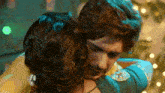 a man and a woman are hugging each other