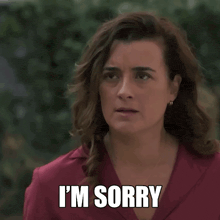 a woman with her eyes closed and the words i 'm sorry above her