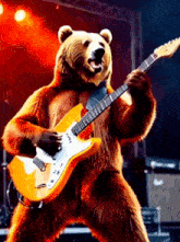 a brown bear is playing an electric guitar on stage