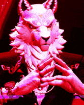 a cartoon character with horns is wearing a suit and a watch