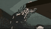 a pixelated drawing of a person 's arm with black spots on it