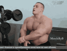 alexey lesukov bodybuilder posing biceps