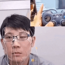 a man wearing glasses and earbuds is holding a logitech controller in front of his face