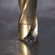 drill spinning slow mo gold