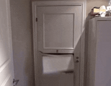 a person 's foot is sticking out of a door with the letter b on the door