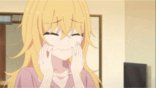 a girl with long blonde hair is making a face with her hands