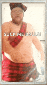 a shirtless man wearing a kilt and a hat is standing in front of a white wall .
